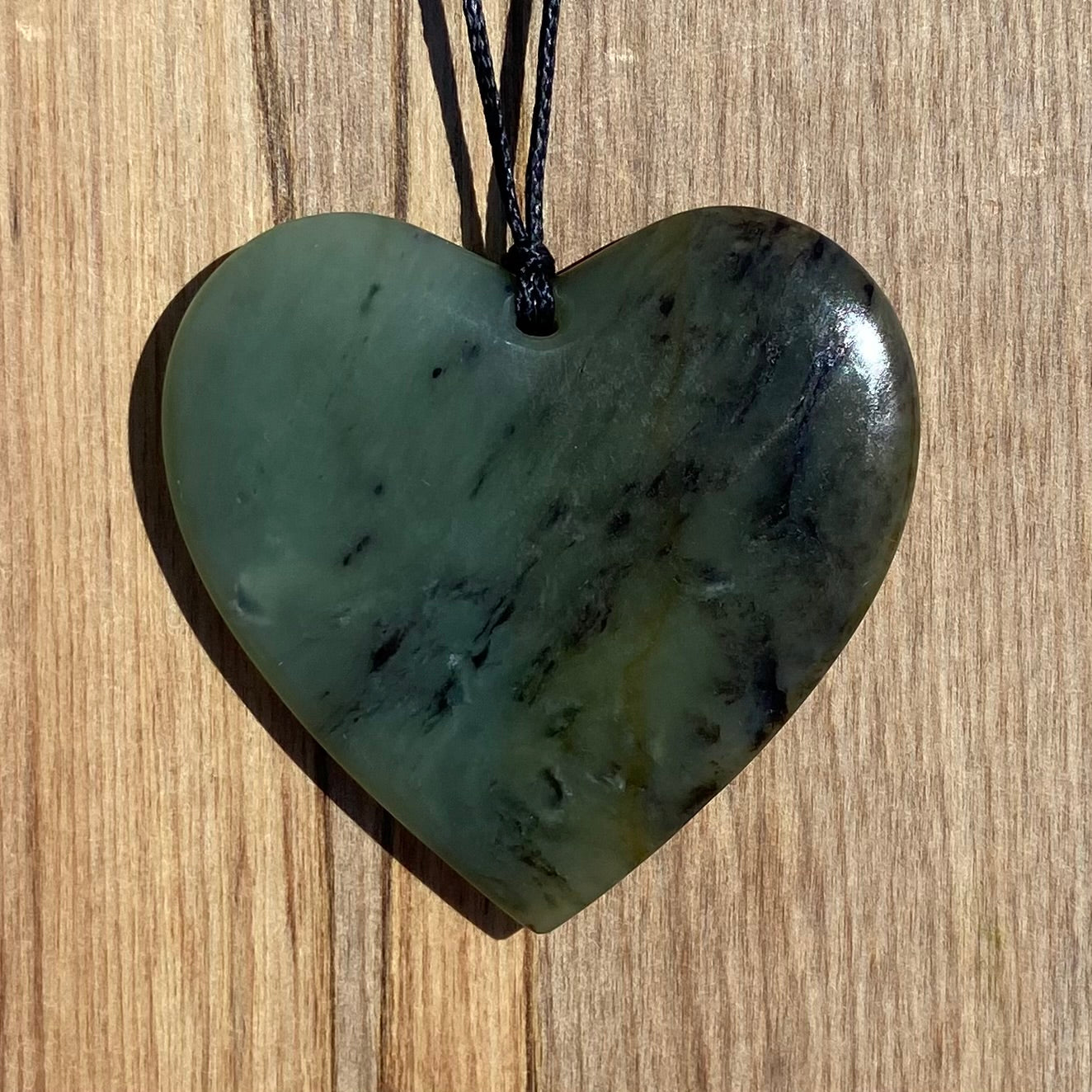 Heart pendant carved from NZ totoweka jade pounamu