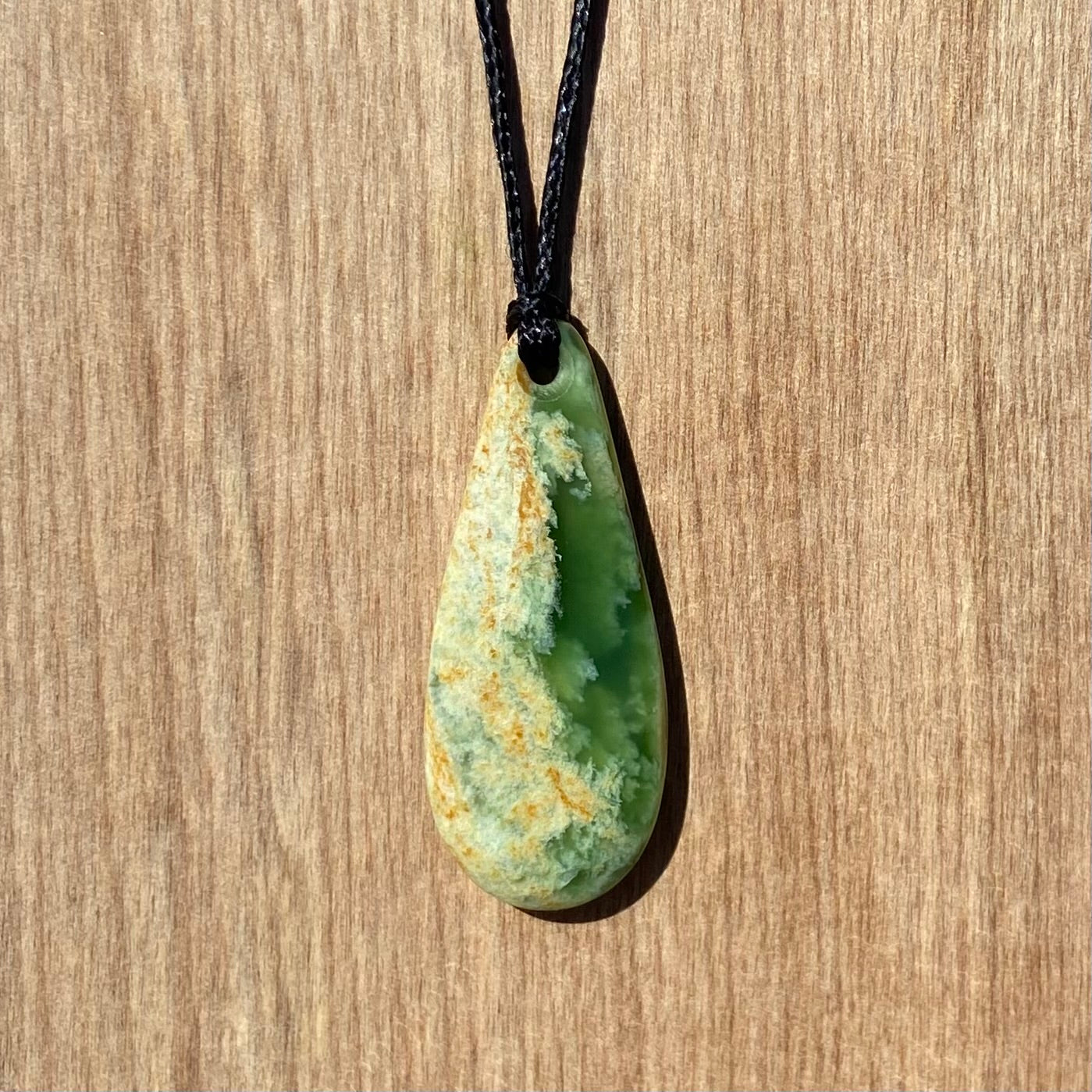 Roimata teardrop pendant carved from NZ flower jade