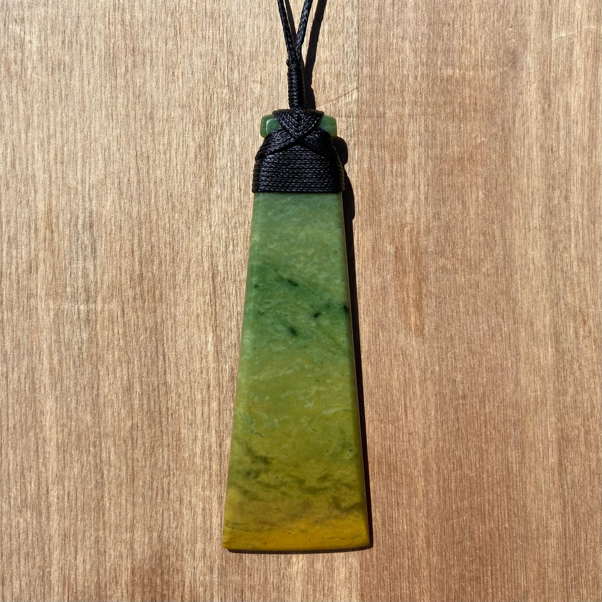 Toki pendant hand-carved from New Zealand Marsden Flower Jade/ pounamu (greenstone). Front.