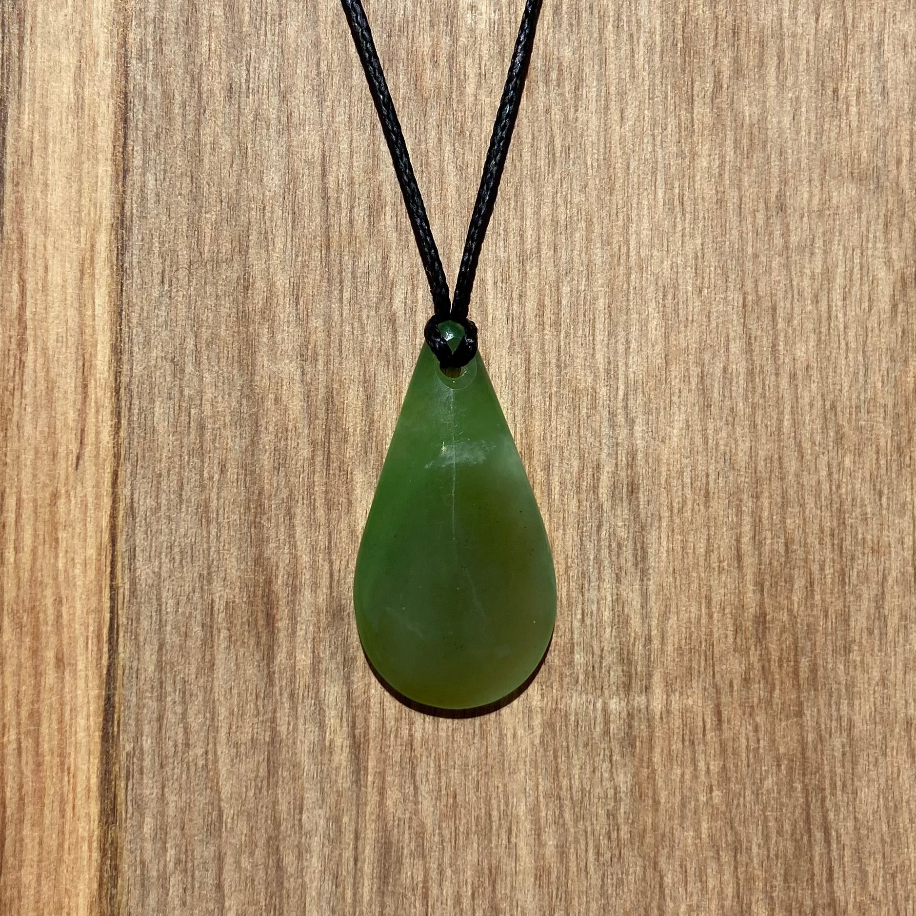 Roimata (drop) pendant hand-carved from New Zealand kahurangi pounamu (greenstone). Front.