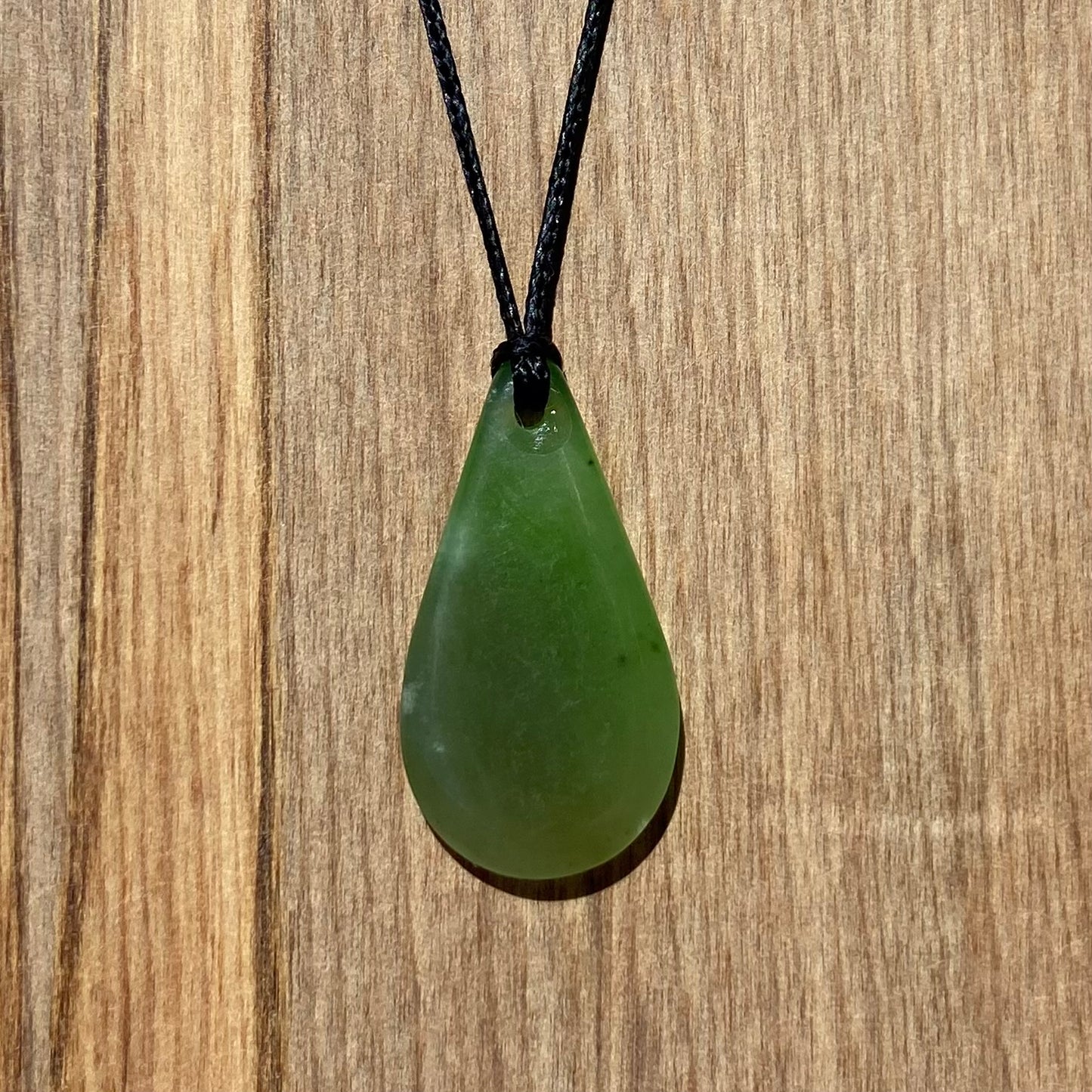 Roimata (drop) pendant hand-carved from New Zealand kahurangi pounamu (greenstone). Back.
