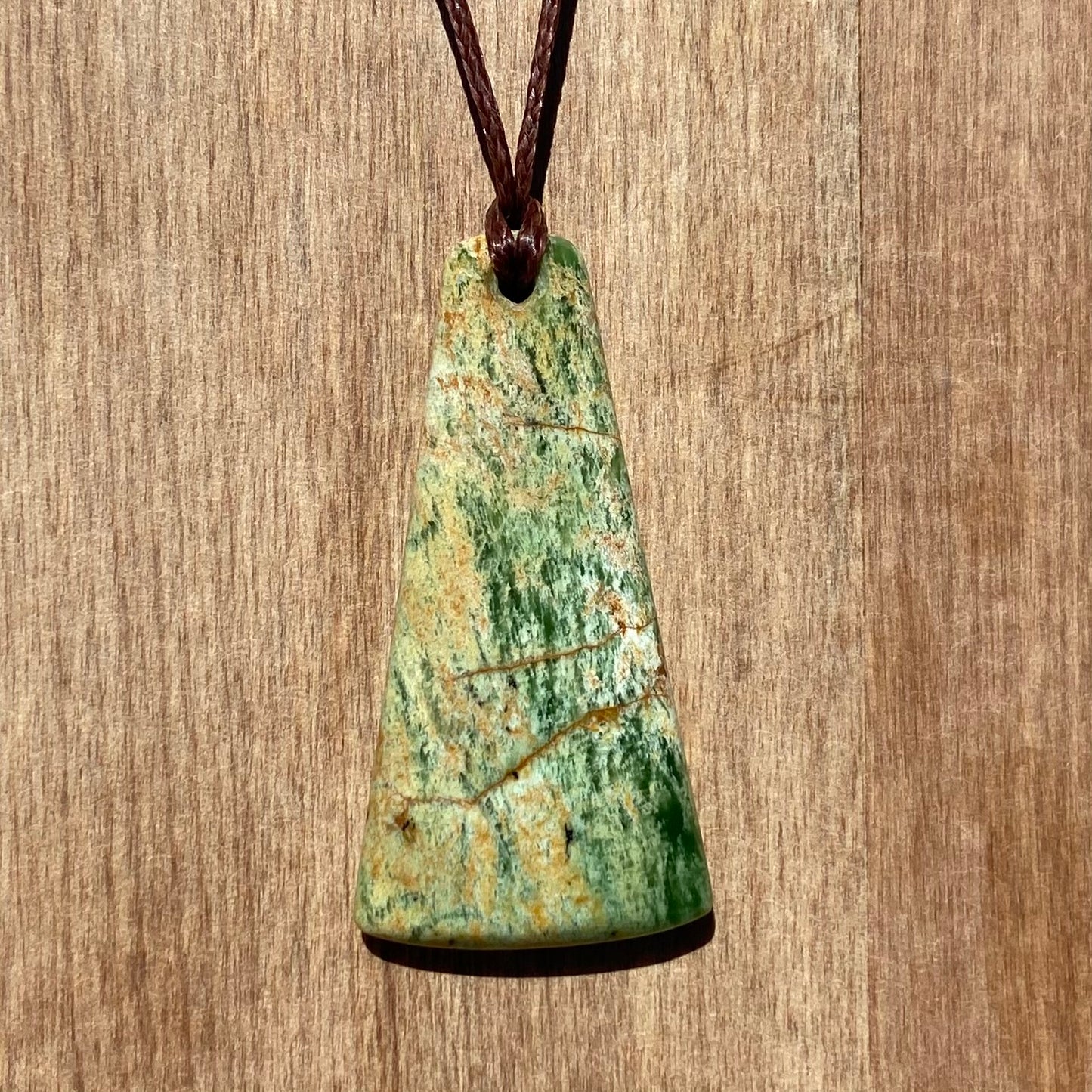 Toki pendant hand-carved from New Zealand Marsden Flower Jade/ pounamu (greenstone). Front.