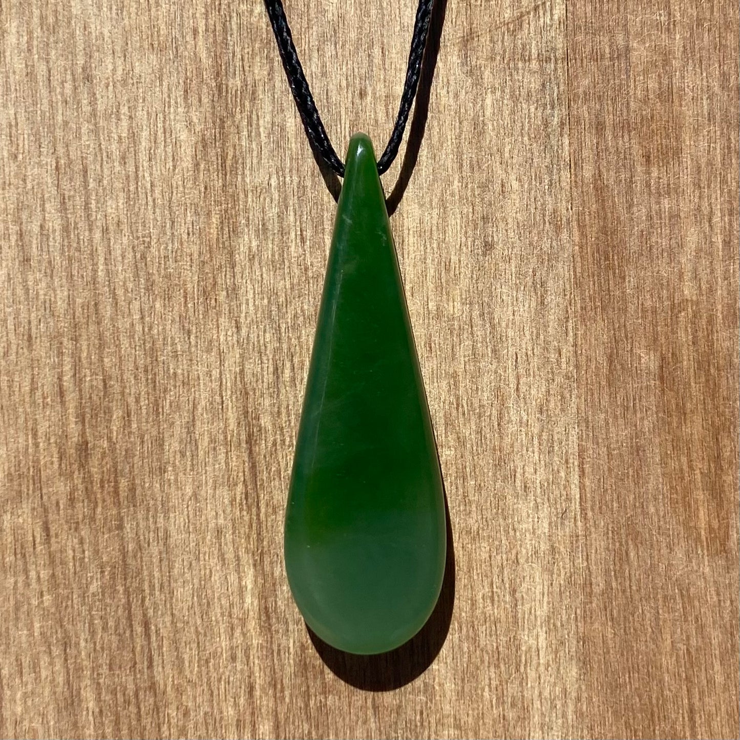 Roimata (teardrop) pendant hand-carved from New Zealand kahurangi  pounamu (greenstone). Back.