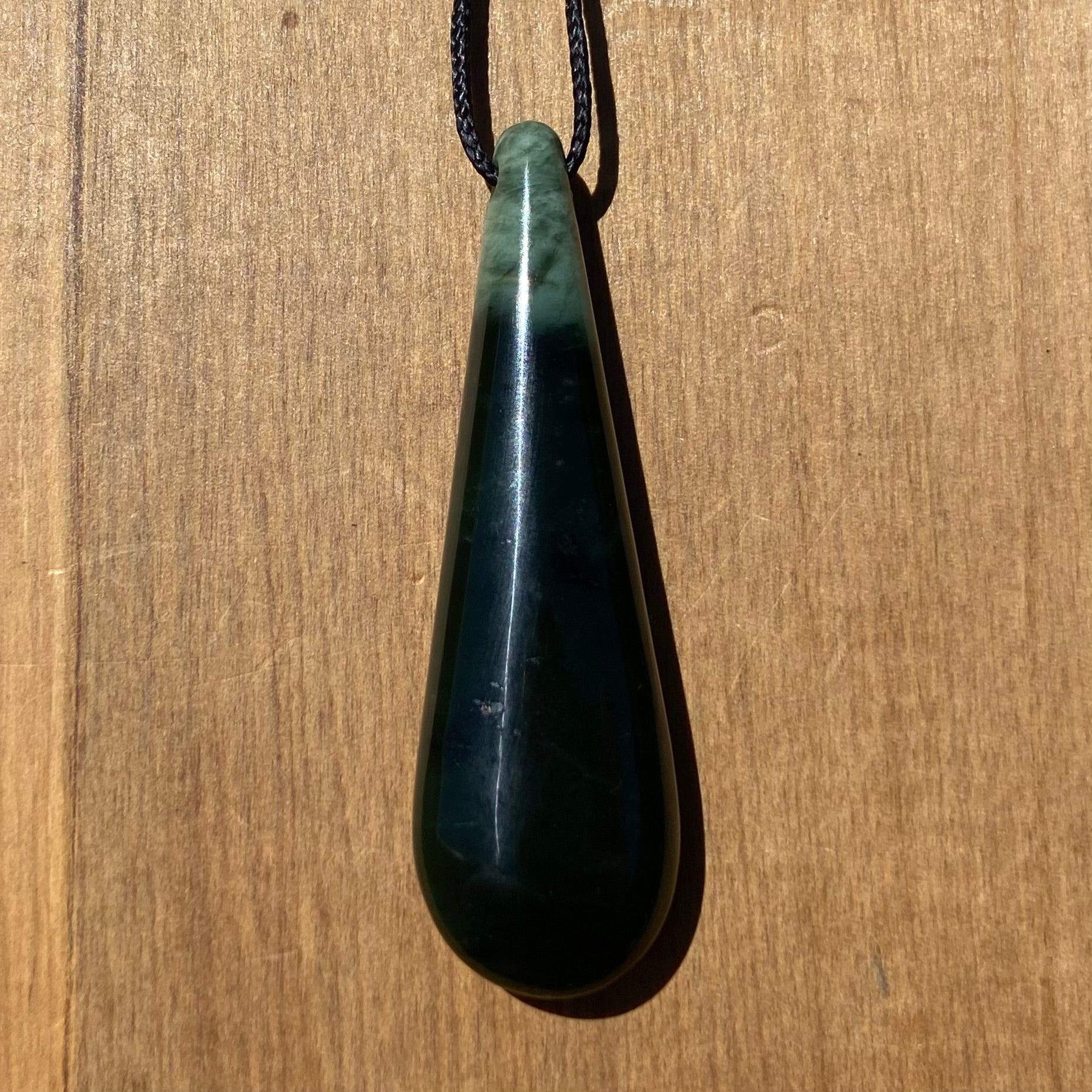 Toki pendant hand-carved from New Zealand kawawkawa pounamu (greenstone). 