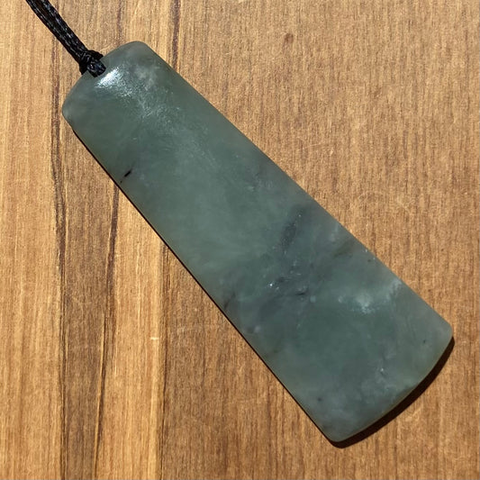 Toki pendant hand-carved from New Zealand inanga pounamu (greenstone). Front.