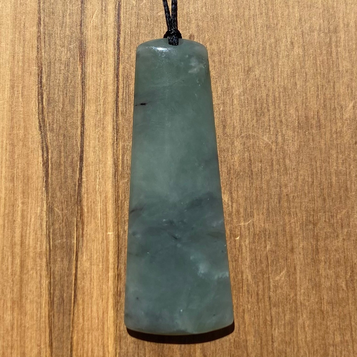 Toki pendant hand-carved from New Zealand inanga pounamu (greenstone). Front.