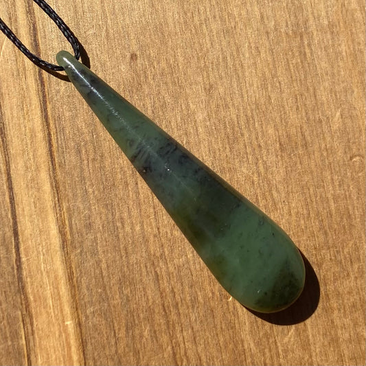 Toki pendant hand-carved from New Zealand kawawkawa pounamu (greenstone). Front.