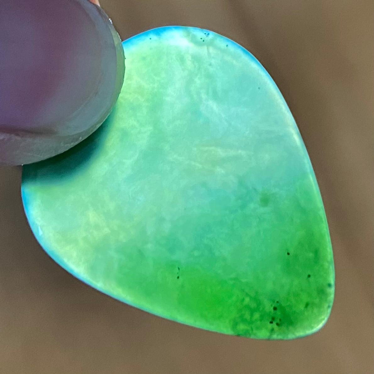 Guitar pick hand-carved from New Zealand Kahurangi Greenstone pounamu (greenstone). Translucency.