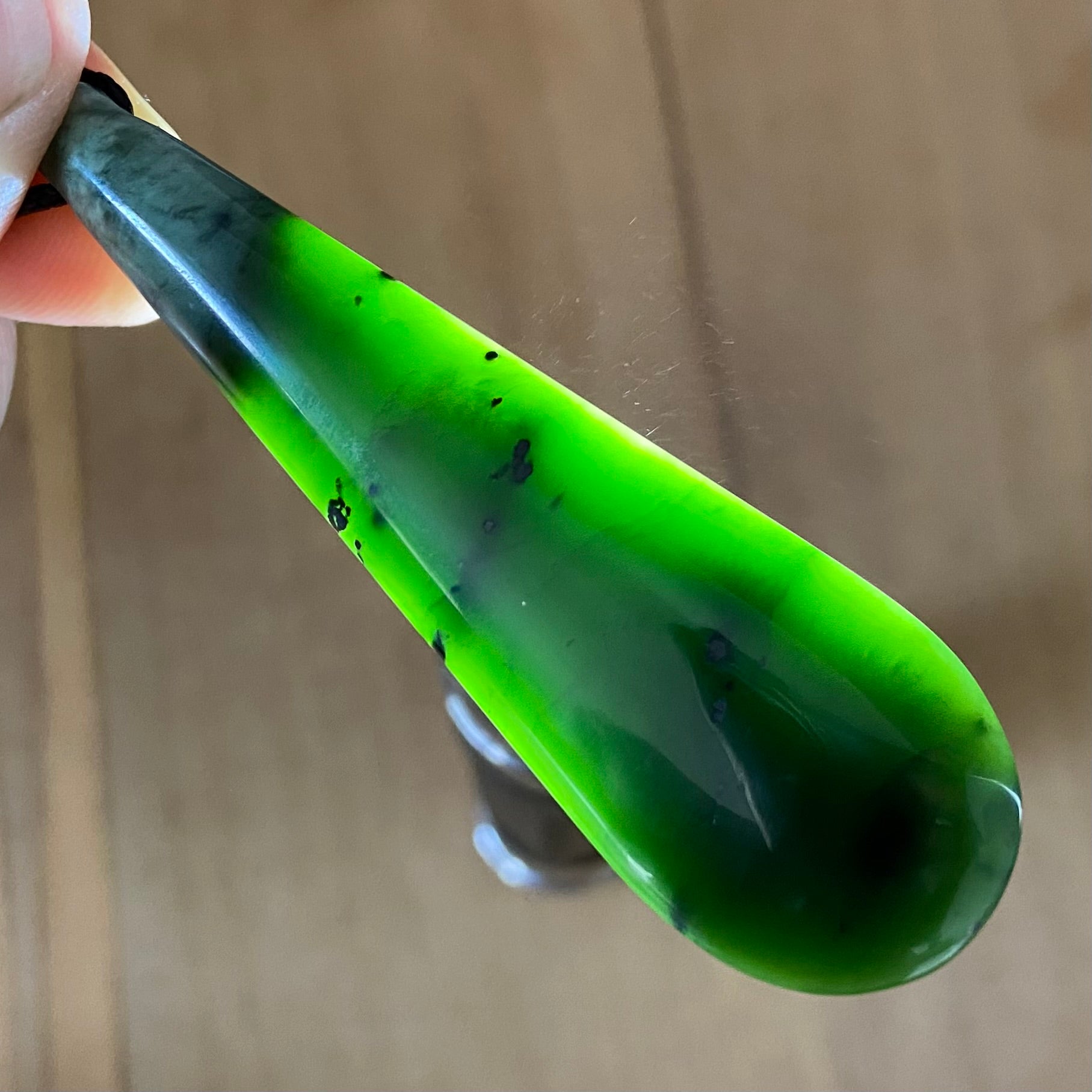 Toki pendant hand-carved from New Zealand kawawkawa pounamu (greenstone). Translucency