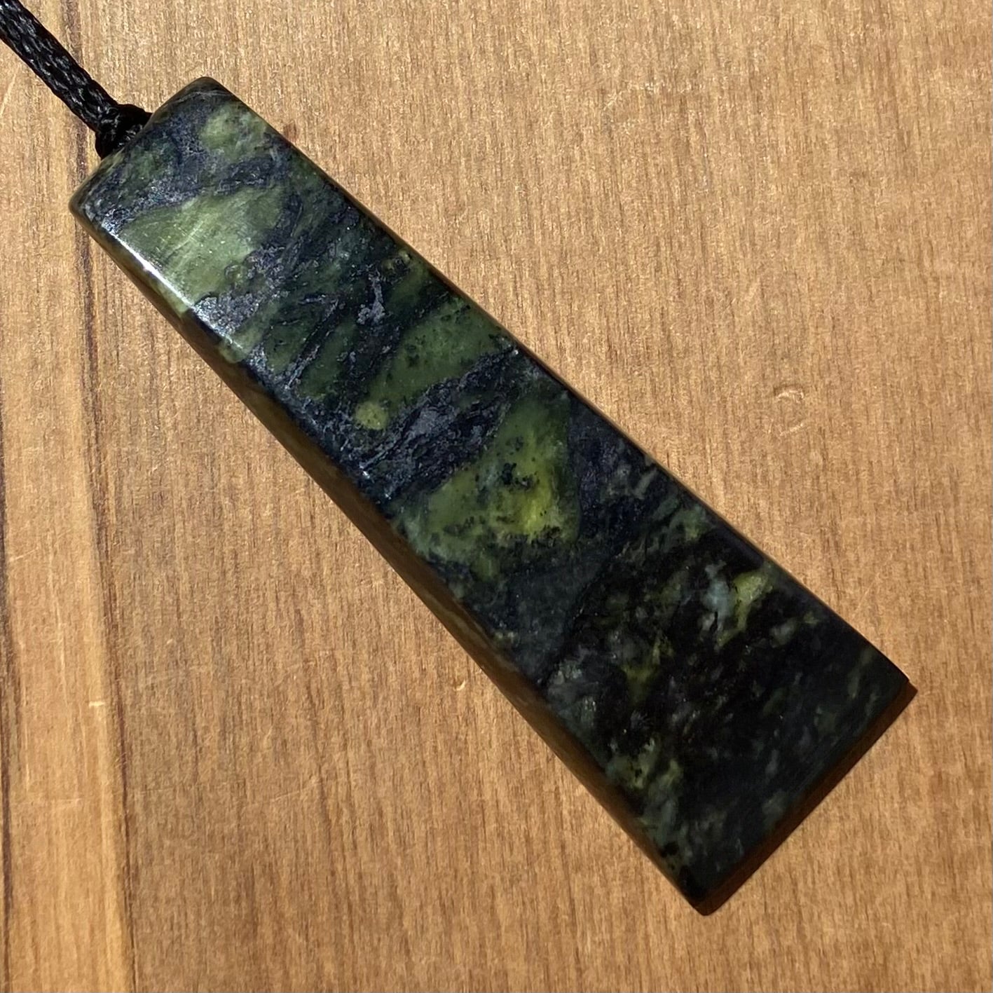 Toki pendant hand-carved from New Zealand Douglas Creek pounamu (greenstone). Angle.