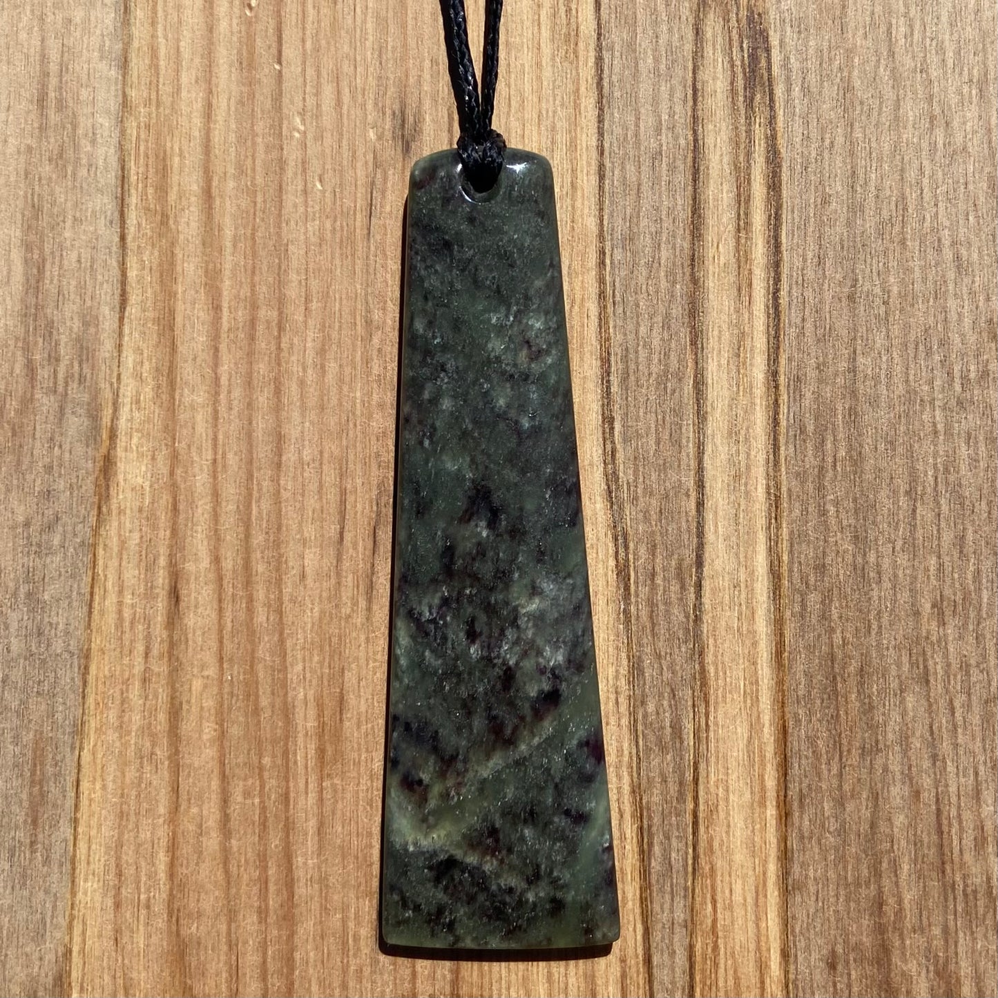 Toki pendant hand-carved from New Zealand totoweka pounamu (greenstone). Front.