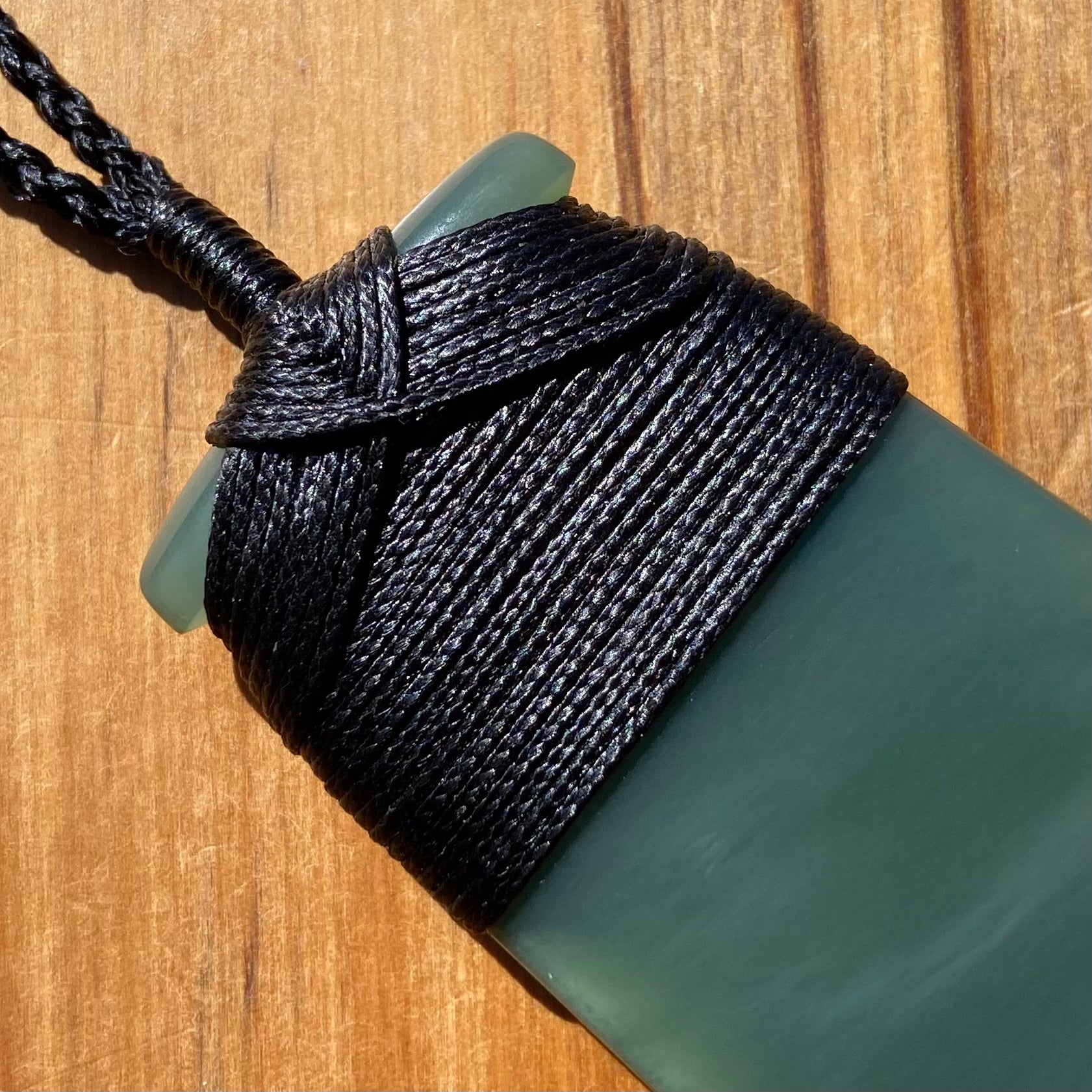 Bound toki pendant hand-carved from New Zealand inanga pounamu (greenstone). Binding.