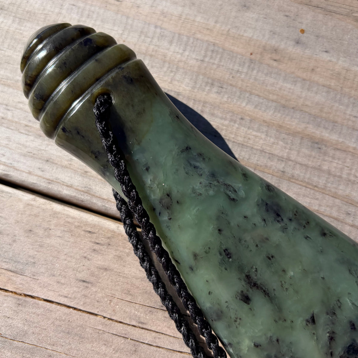 Pounamu mere hand-carved from South Westland Inanga pounamu (greenstone). Handle.