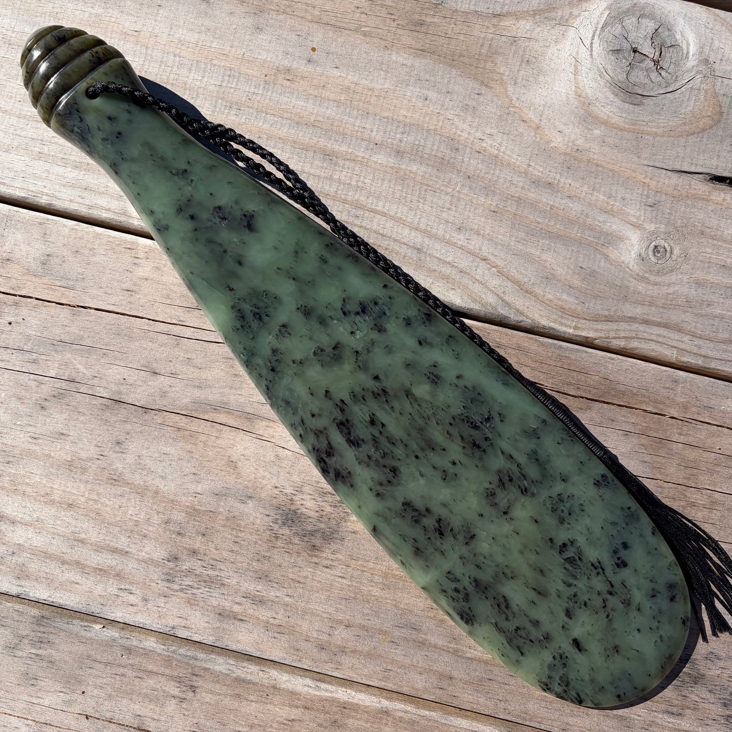 Pounamu mere hand-carved from South Westland Inanga pounamu (greenstone). Front.