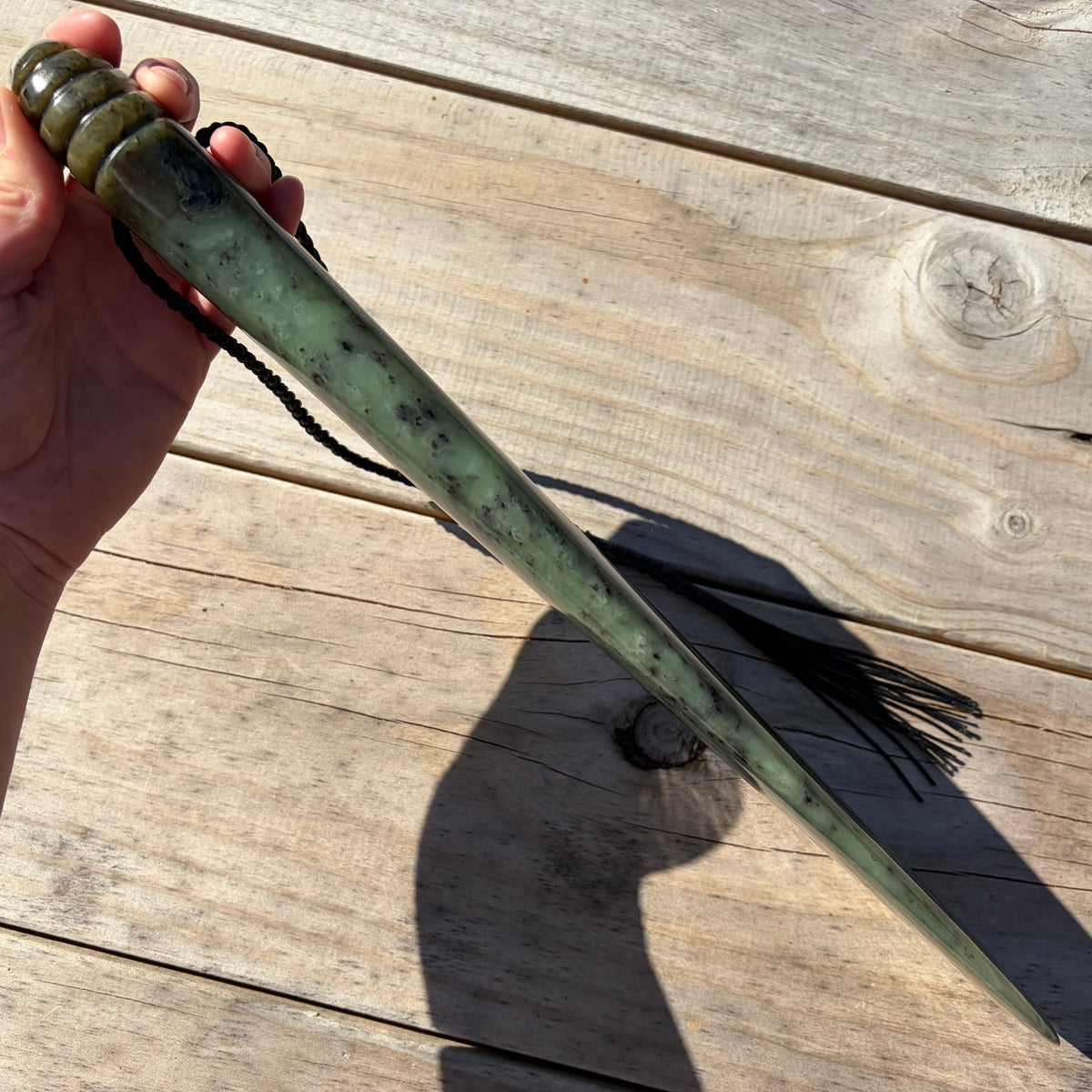 Pounamu mere hand-carved from South Westland Inanga pounamu (greenstone). Edge.