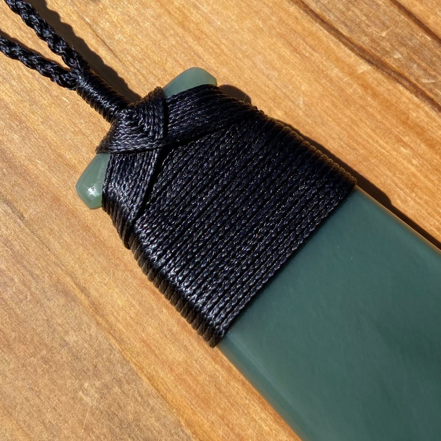 Bound toki pendant hand-carved from New Zealand inanga pounamu (greenstone). Binding.