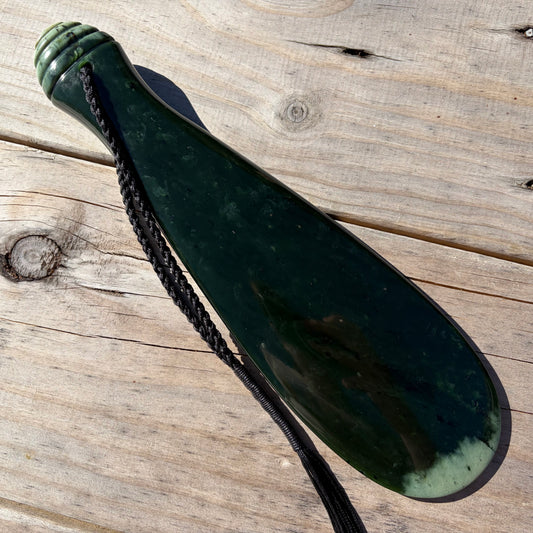Mere / Patu  hand-carved from New Zealand Kawakawa pounamu (greenstone). Front.