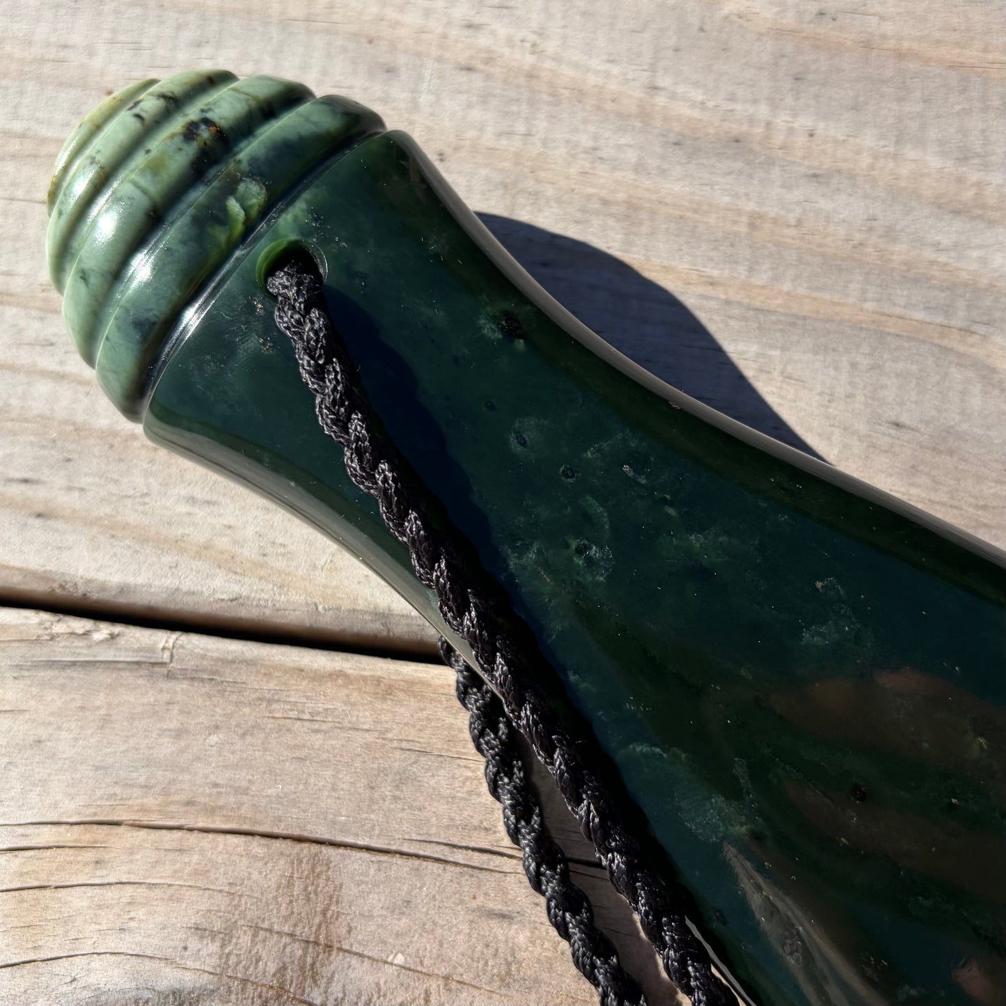 Mere / Patu  hand-carved from New Zealand Kawakawa pounamu (greenstone). Handle.
