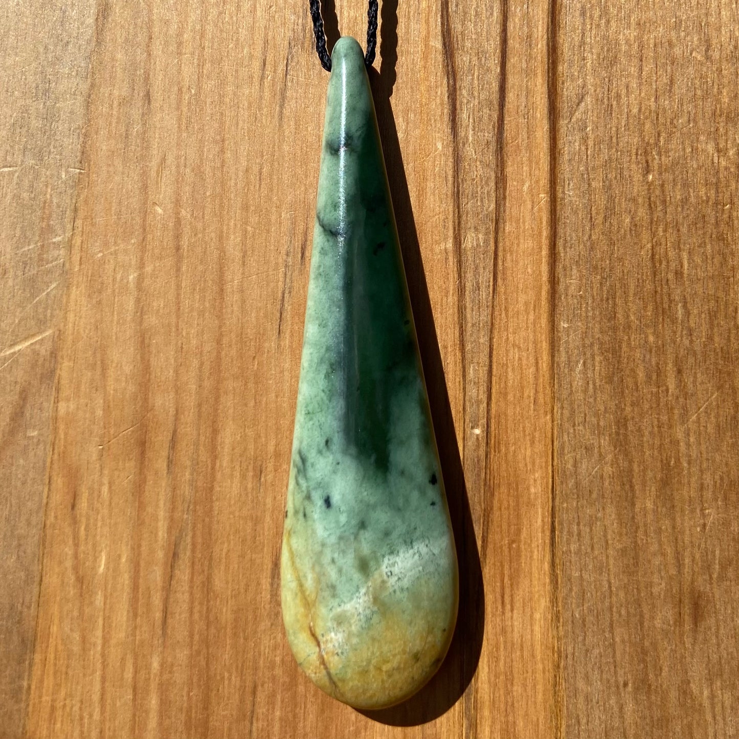 XL roimata teardrop pendant carved from New Zealand Marsden Flower Jade (greenstone). Front.
