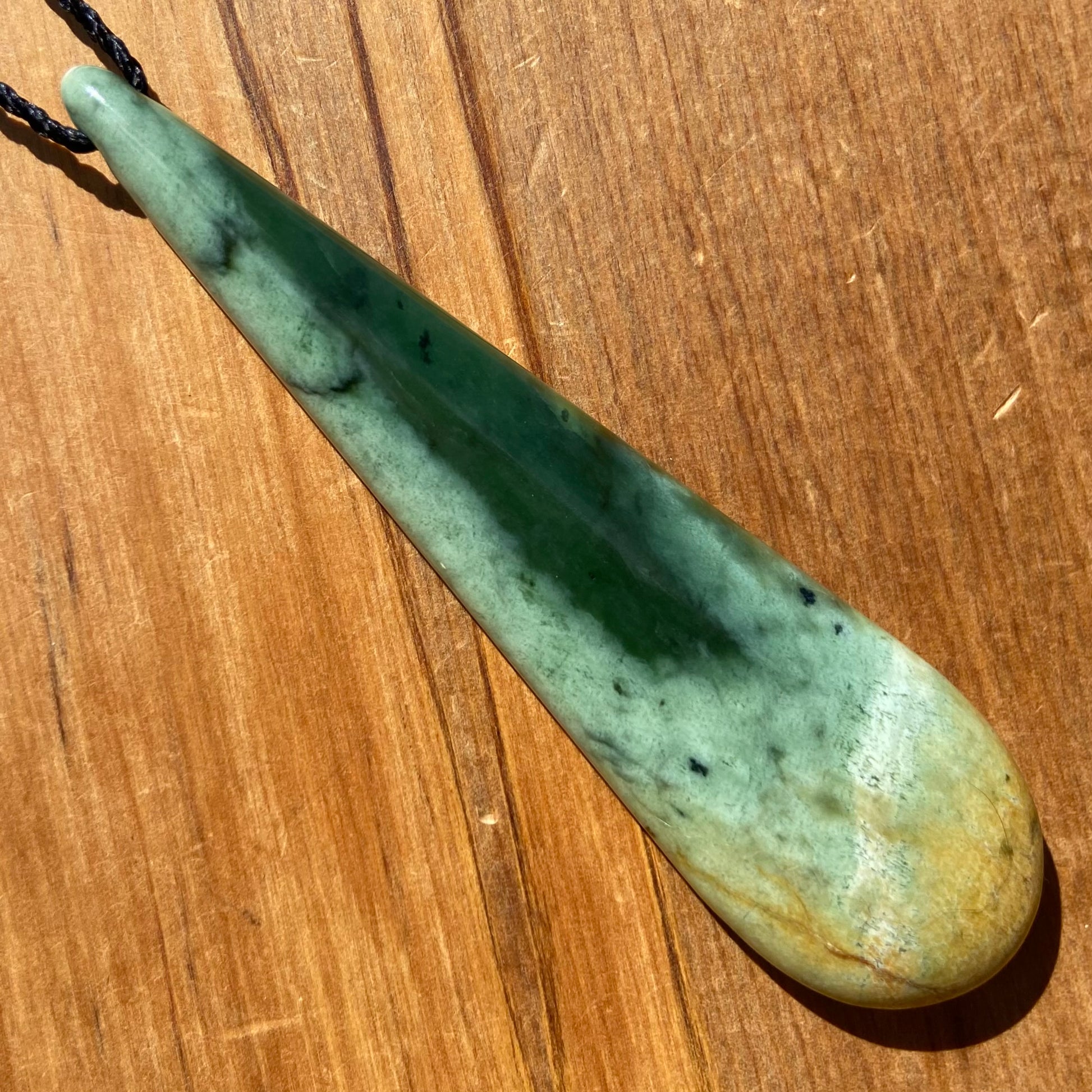 XL roimata teardrop pendant carved from New Zealand Marsden Flower Jade (greenstone). Front.