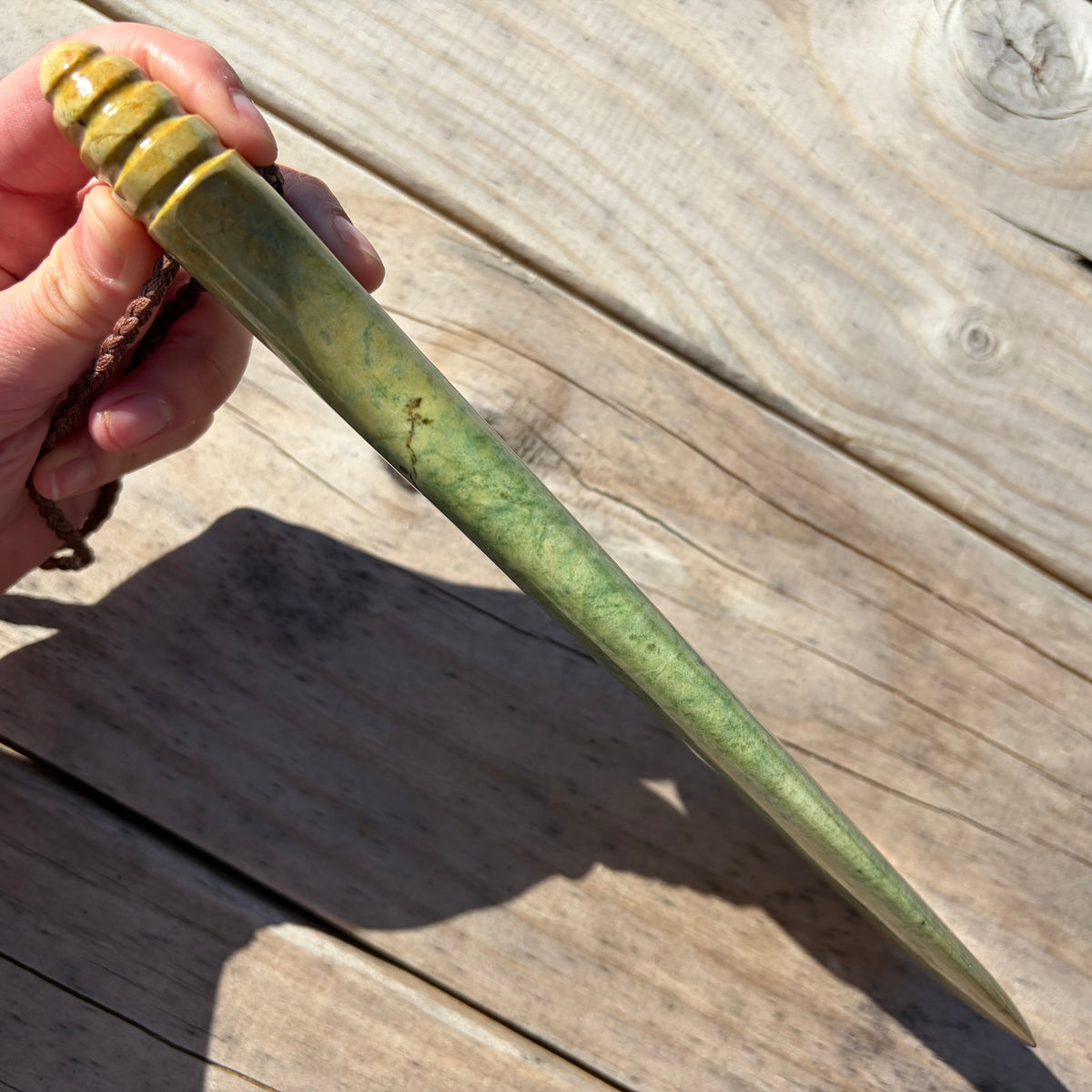 Pounamu mere hand-carved from Marsden flower jade pounamu (greenstone). Edge.