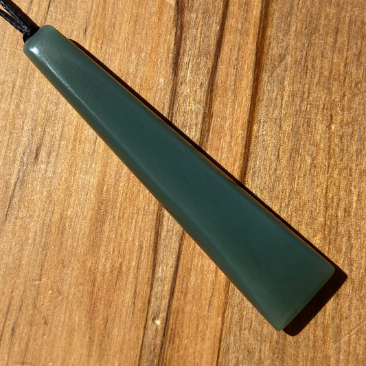 Toki pendant hand-carved from New Zealand inanga pounamu (greenstone). Front.