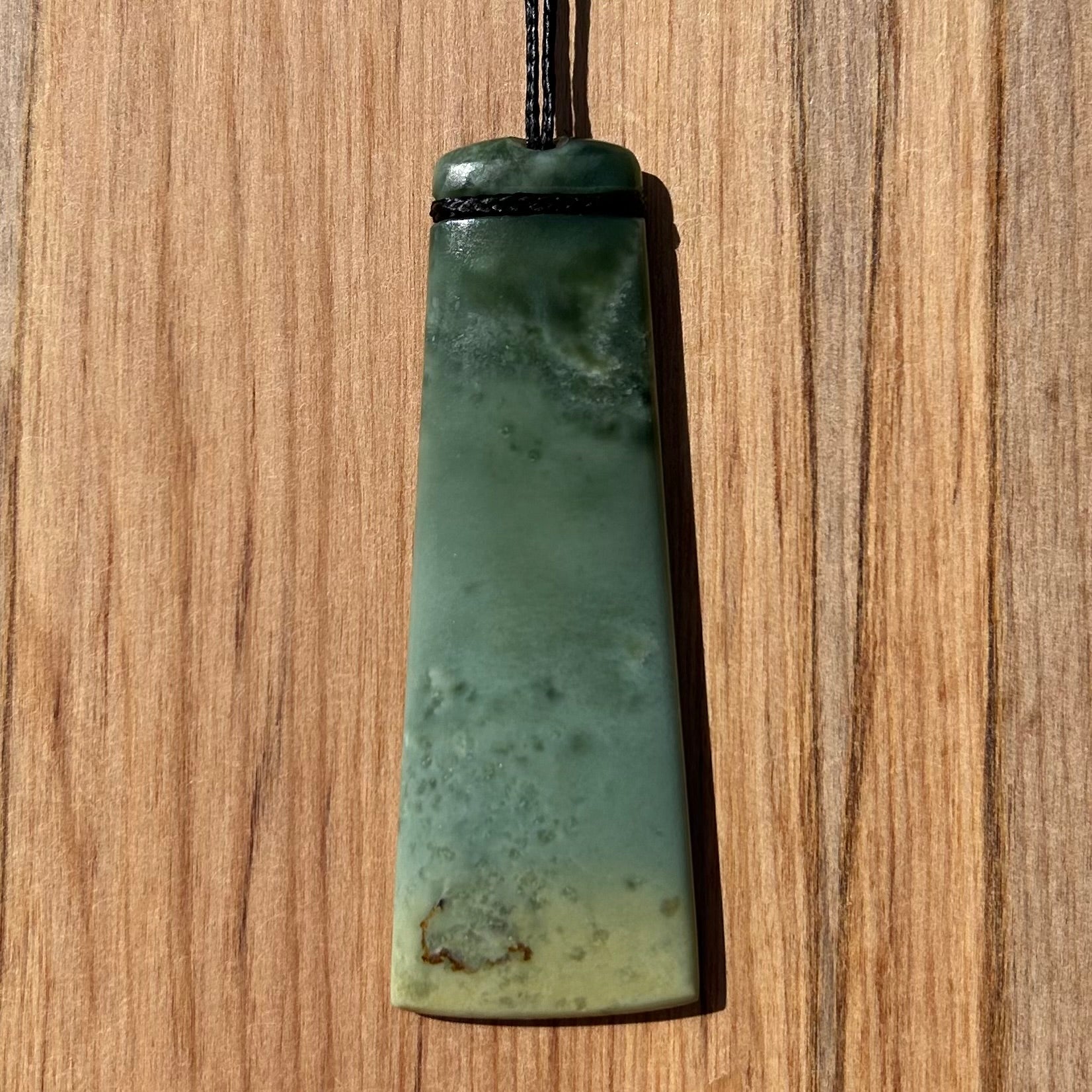 Toki pendant hand-carved from New Zealand inanga pounamu (greenstone). Front.