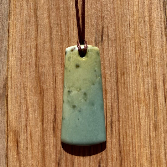 Toki pendant hand-carved from New Zealand inanga pounamu (greenstone). Front.