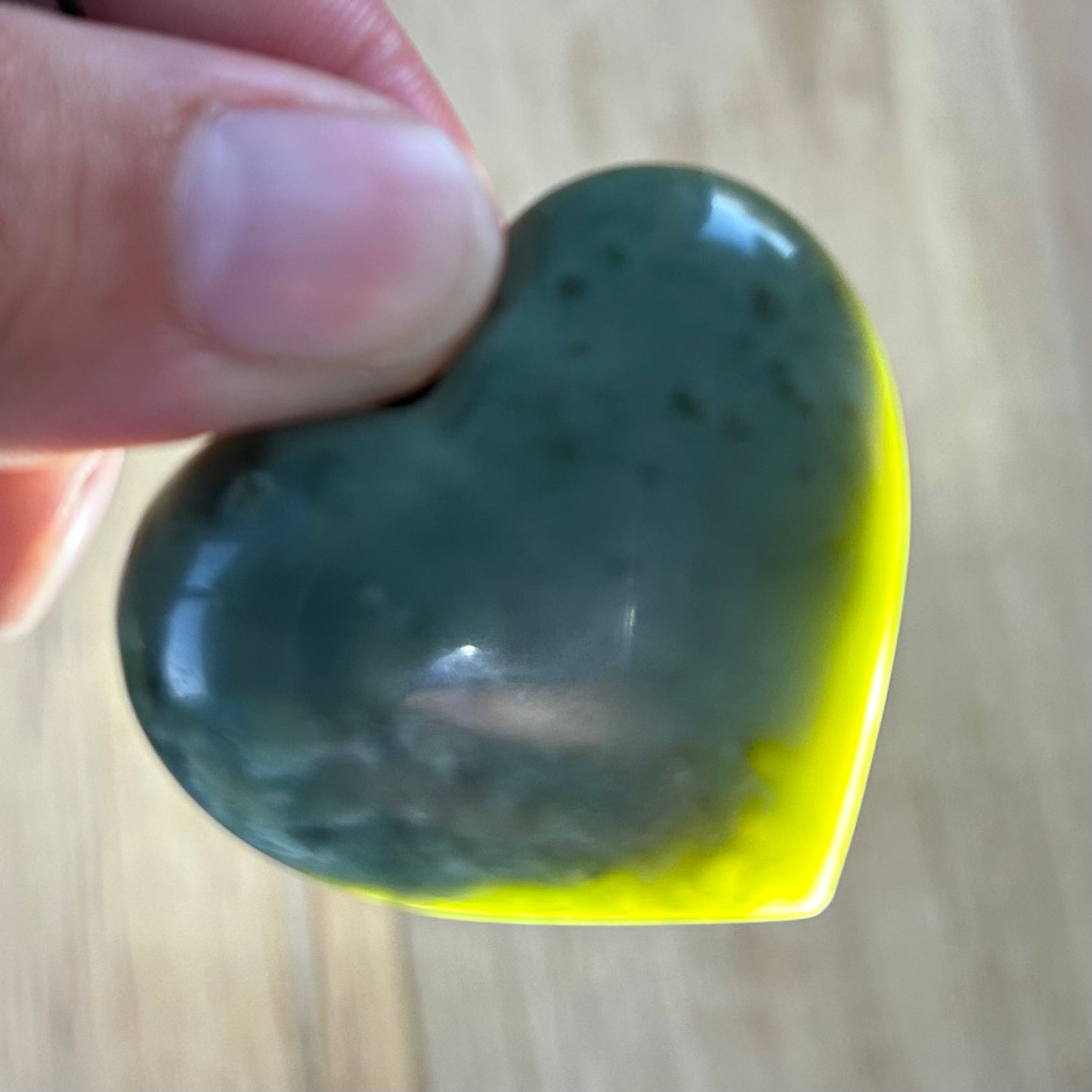 Heart shaped pendant hand-carved from New Zealand inanga pounamu (greenstone). Translucency.