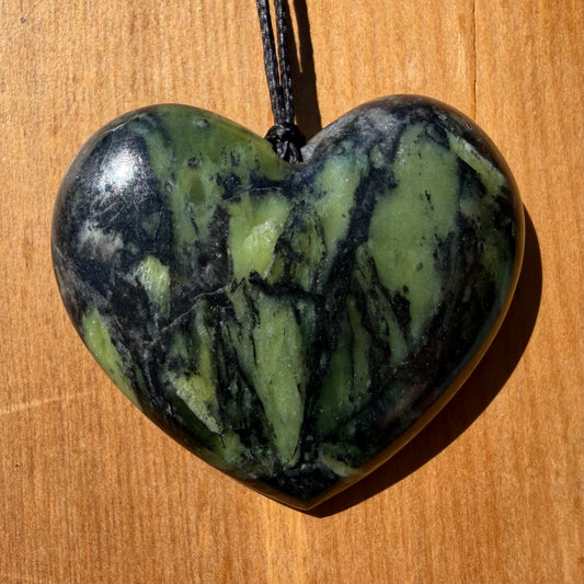 Heart pendant hand-carved from New Zealand Douglas Creek pounamu (greenstone). Front.