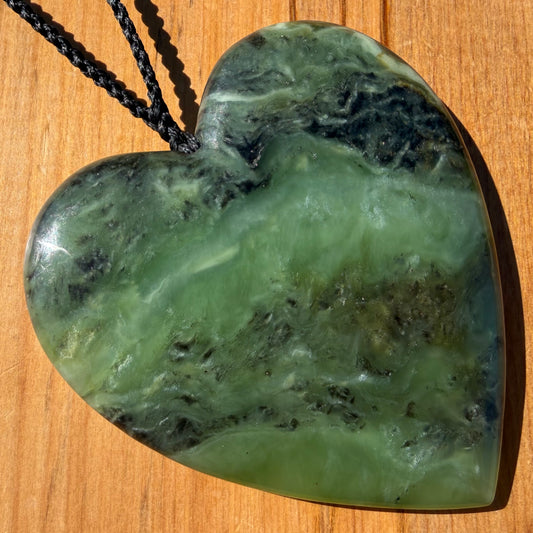 XL Heart pendant hand-carved from New Zealand kawawkawa pounamu (greenstone). Front.