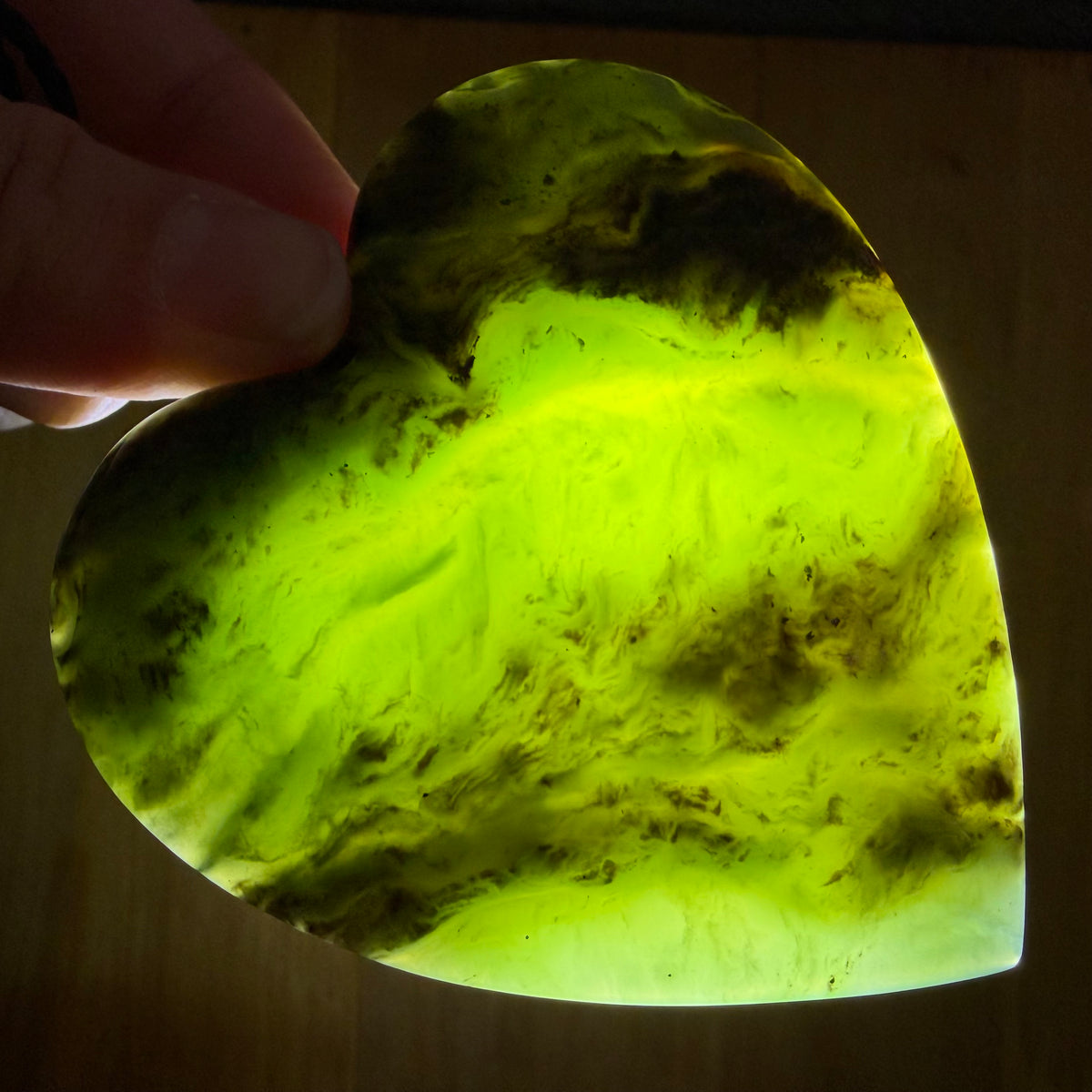 Heart pendant hand-carved from New Zealand kawawkawa pounamu (greenstone). Translucency.