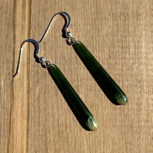 Pair of roimata (teardrop) earrings hand-carved from New Zealand Marsden Flower Jade/ pounamu (greenstone), with sterling silver fittings. Front.
