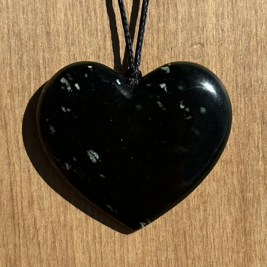 Heart pendant hand-carved from New Zealand tangiwai pounamu (greenstone). Front.