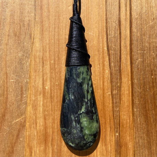 Bound roimata (teardrop) pendant hand-carved from New Zealand Douglas Creek pounamu (greenstone). Front.