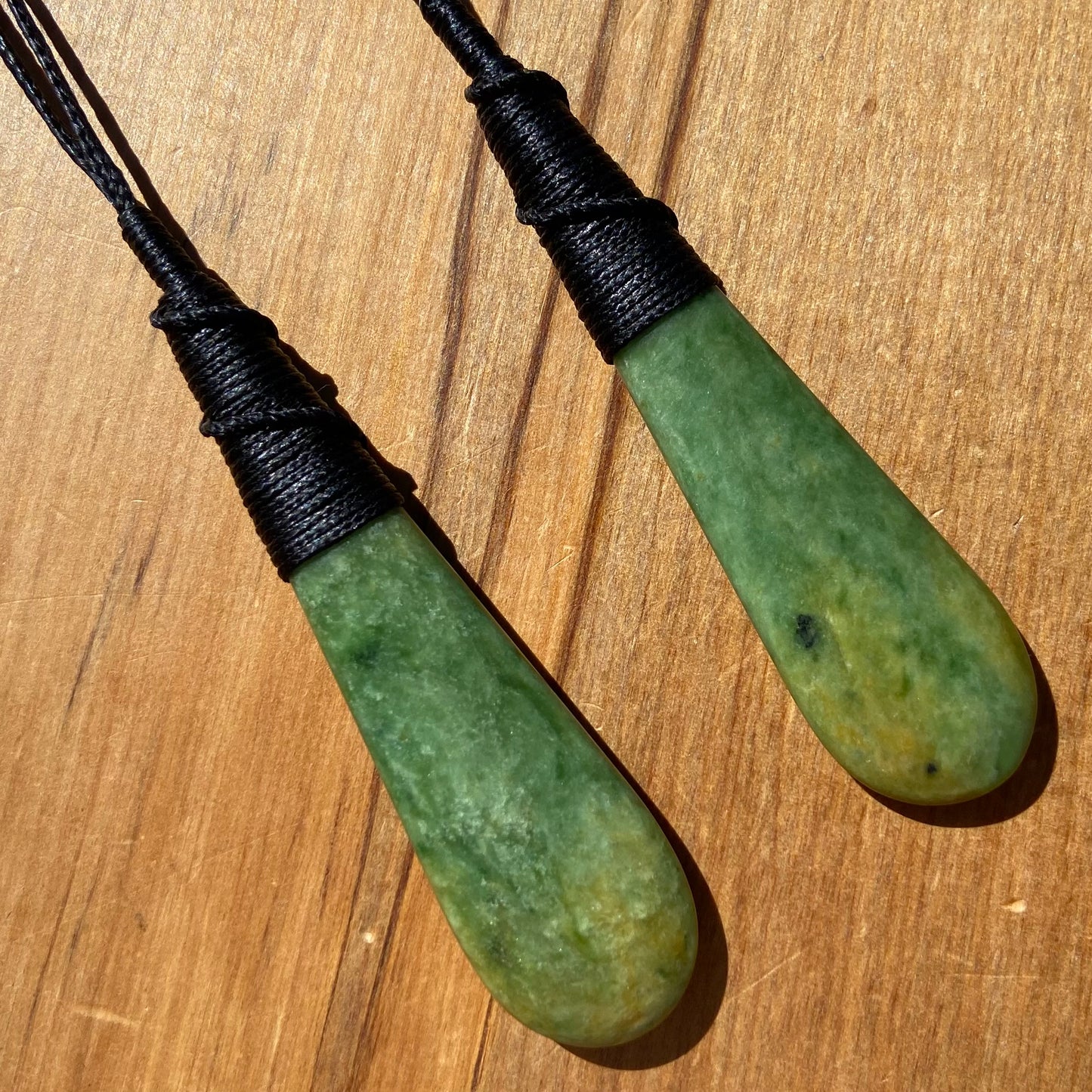 Roimata pendant set hand-carved from New Zealand Marsden Flower Jade/ pounamu (greenstone). Perfect for best friends. Front.