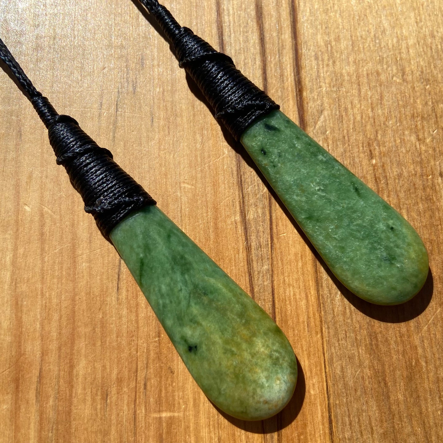 Roimata pendant set hand-carved from New Zealand Marsden Flower Jade/ pounamu (greenstone). Perfect for best friends. Back.