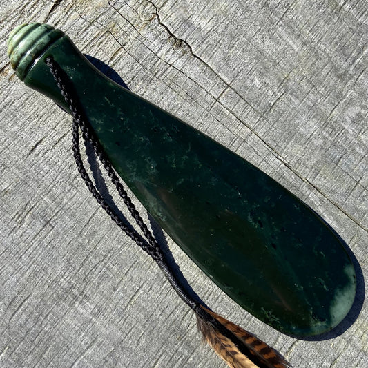 Mere / Patu  hand-carved from New Zealand Kawakawa pounamu (greenstone). Front.