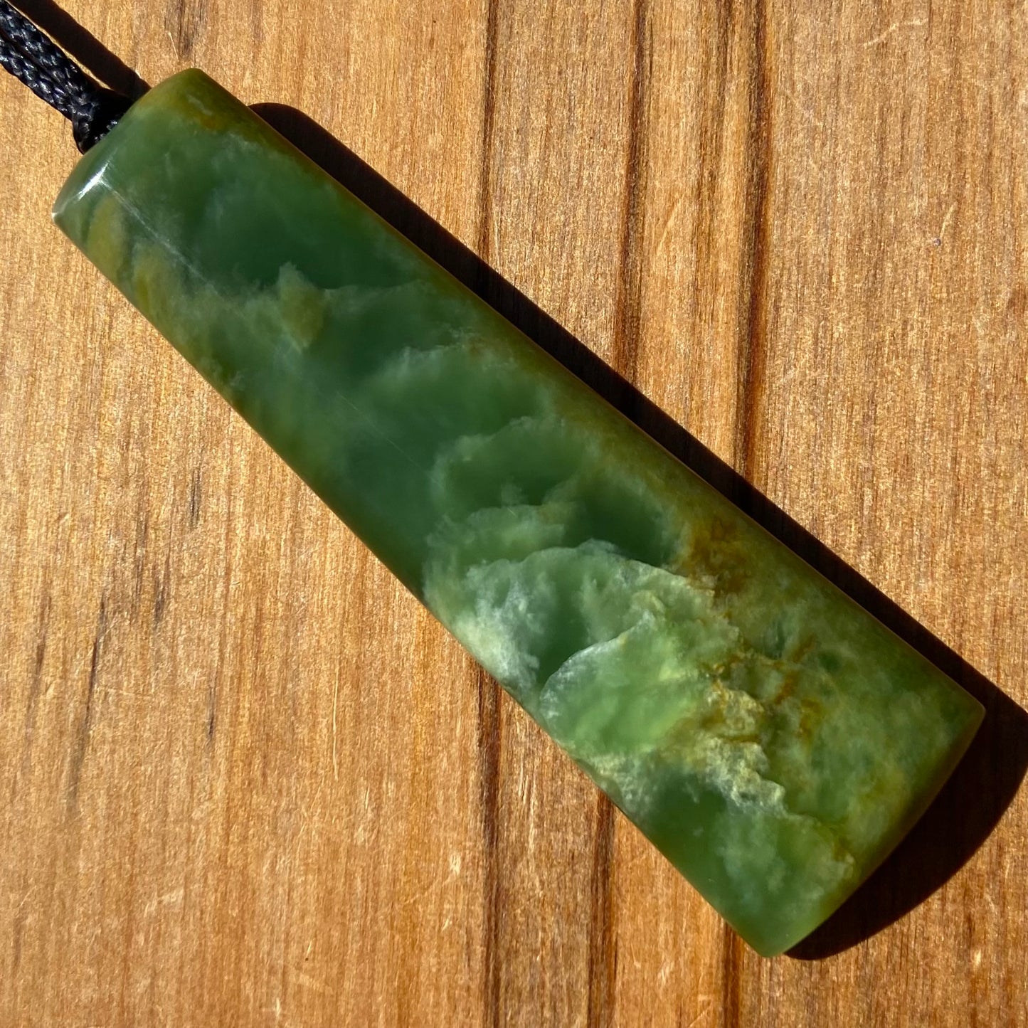 Pounamu toki pendant hand-carved from New Zealand Marsden Flower Jade pounamu (greenstone). Front
