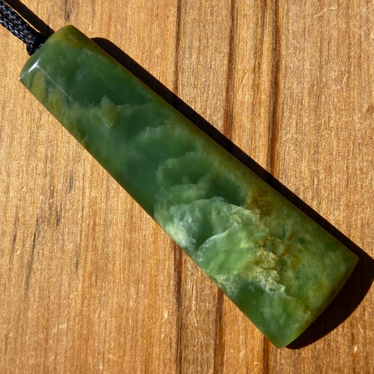 Pounamu toki pendant hand-carved from New Zealand Marsden Flower Jade pounamu (greenstone). Front