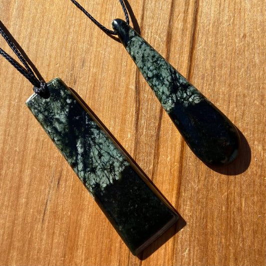 Toki and roimata pendant set hand-carved from New Zealand tangiwai pounamu. Front
