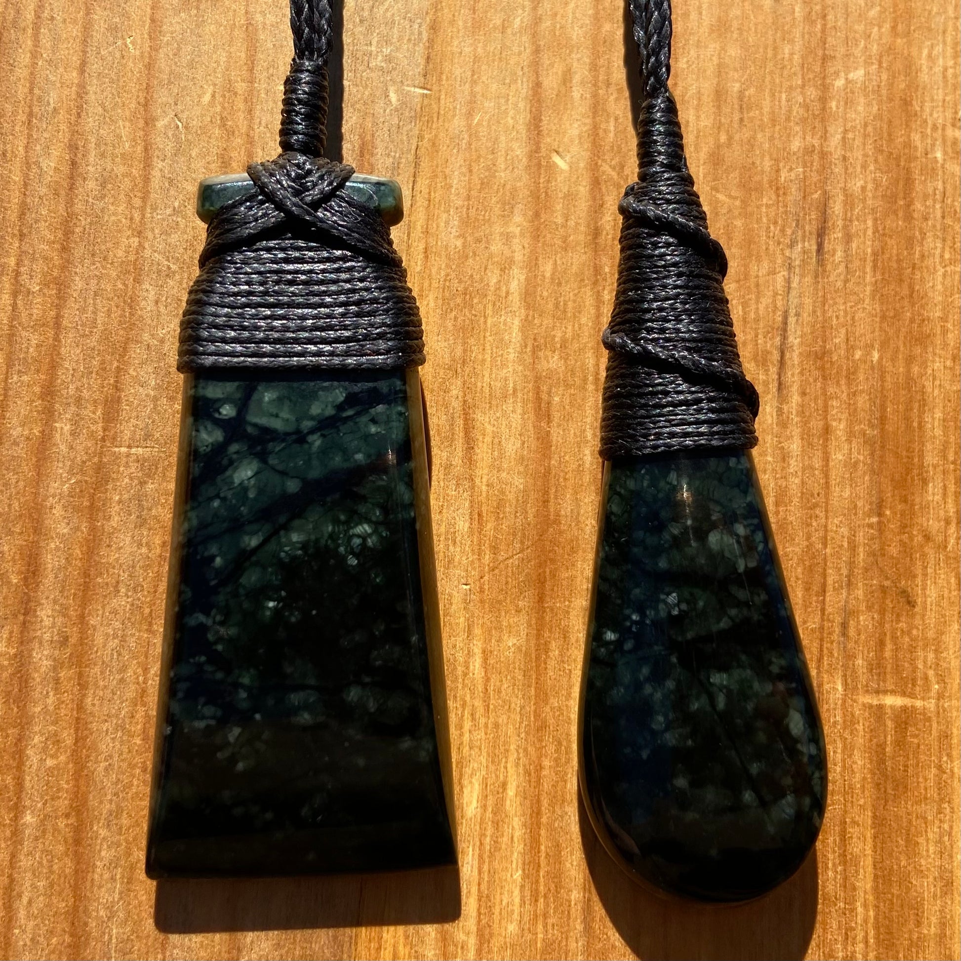 Bound toki and roimata pendant set hand-carved from New Zealand tangiwai pounamu. Front