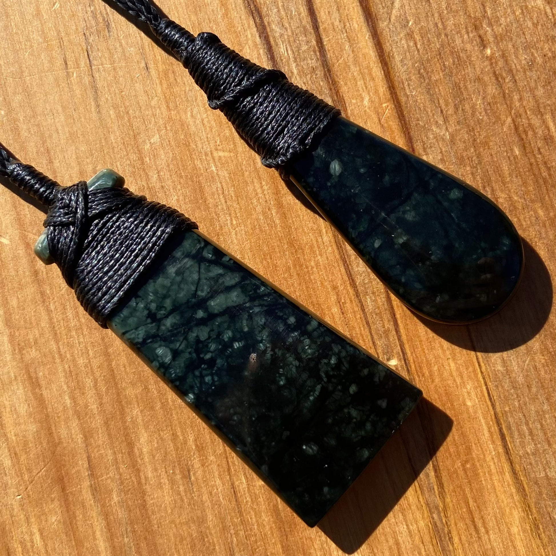 Bound toki and roimata pendant set hand-carved from New Zealand tangiwai pounamu. Back.