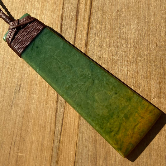Toki pendant hand-carved from New Zealand Marsden Flower Jade/ pounamu (greenstone). Front.