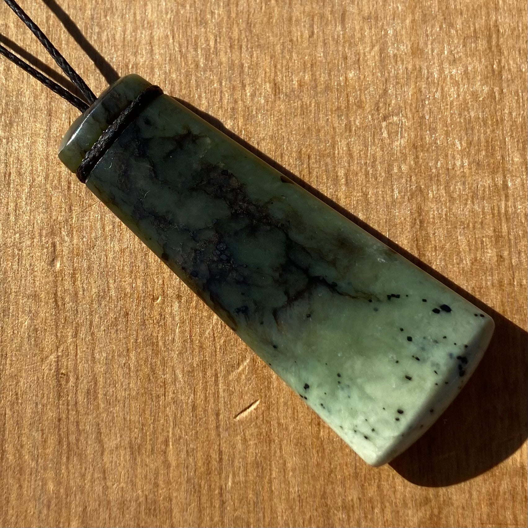 Pounamu toki pendant for children (kids) hand-carved from New Zealand Kawakawa pounamu (greenstone). Front.