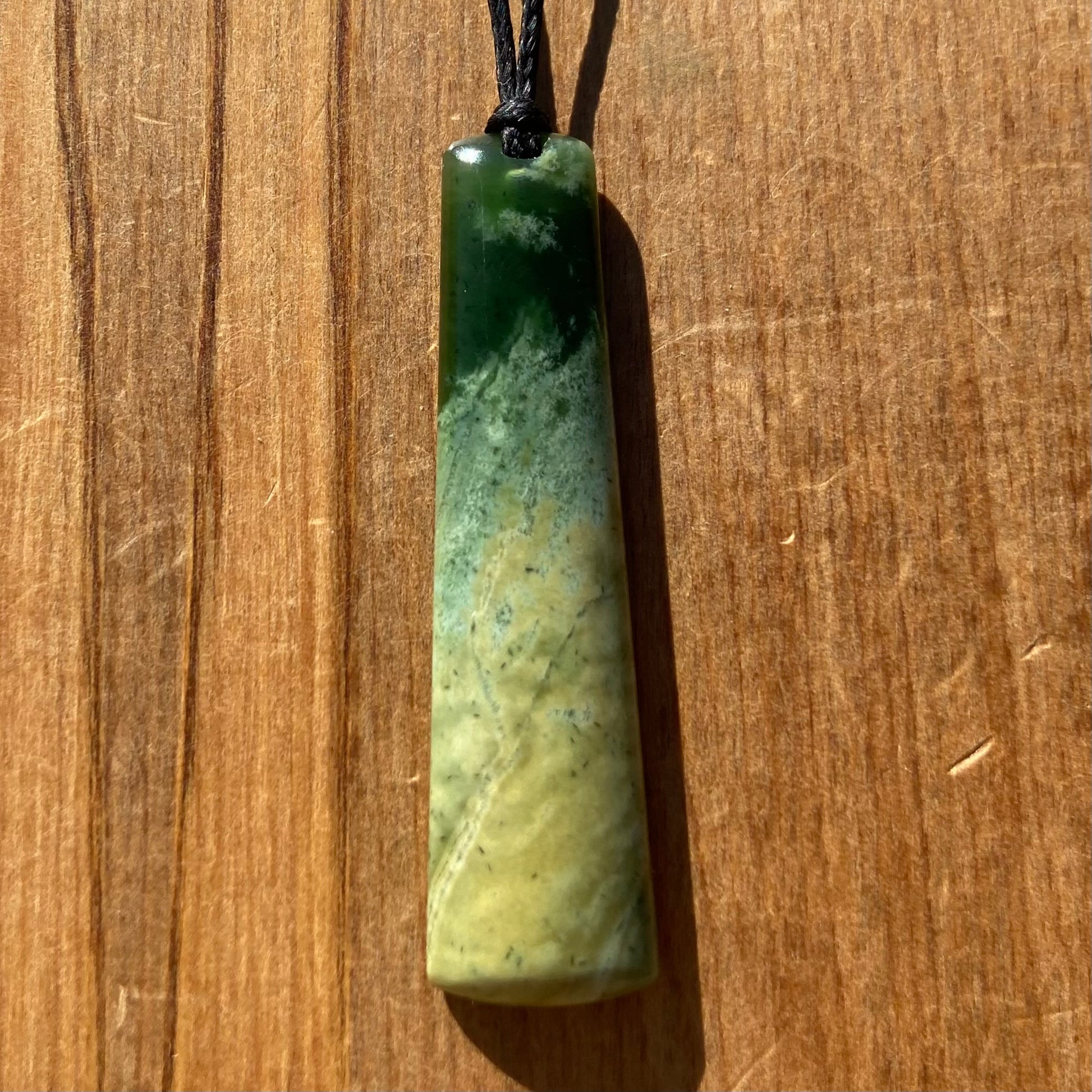 Pounamu toki pendant hand-carved from New Zealand Marsden Flower Jade pounamu (greenstone). Front