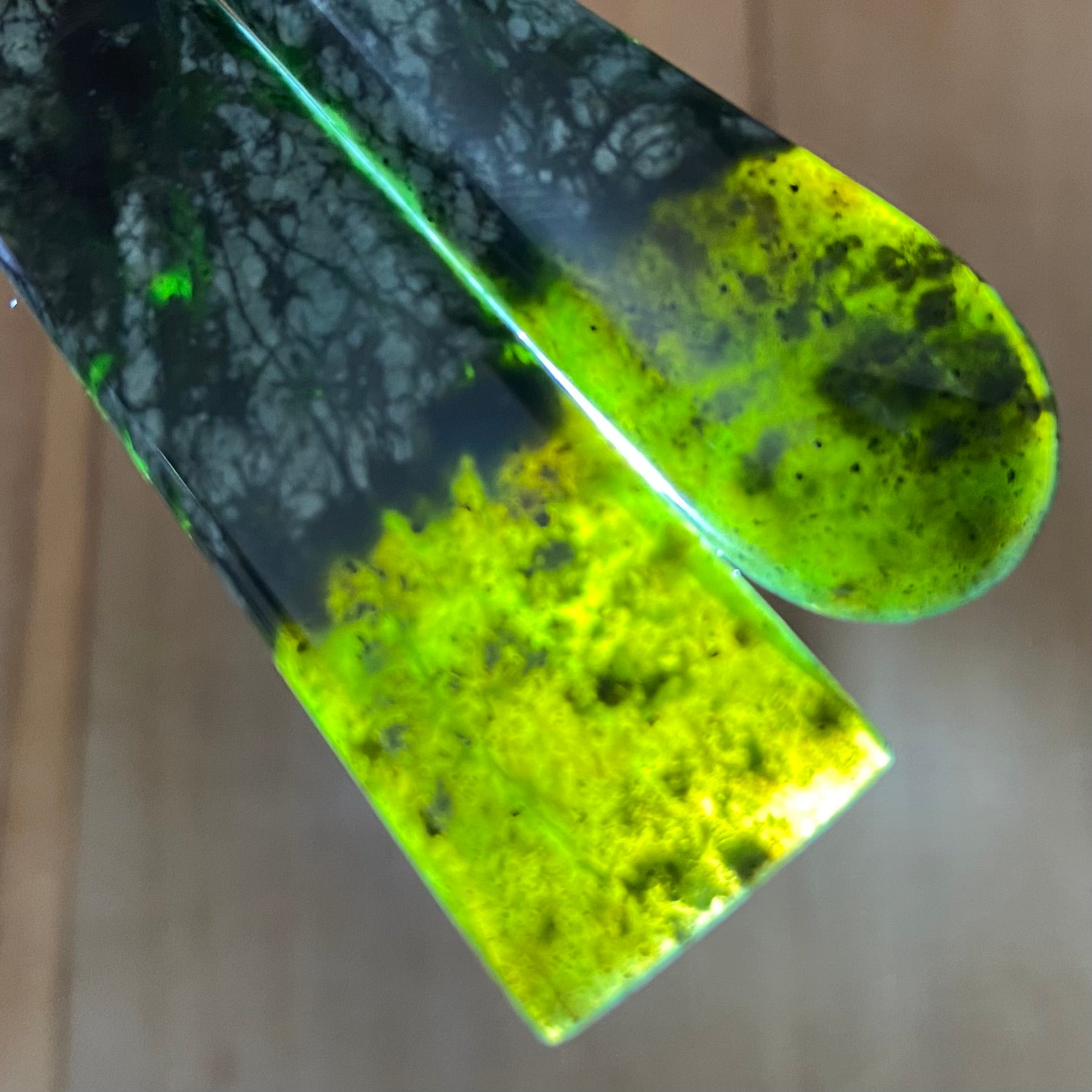 Toki and roimata pendant set hand-carved from New Zealand tangiwai pounamu. Translucency.