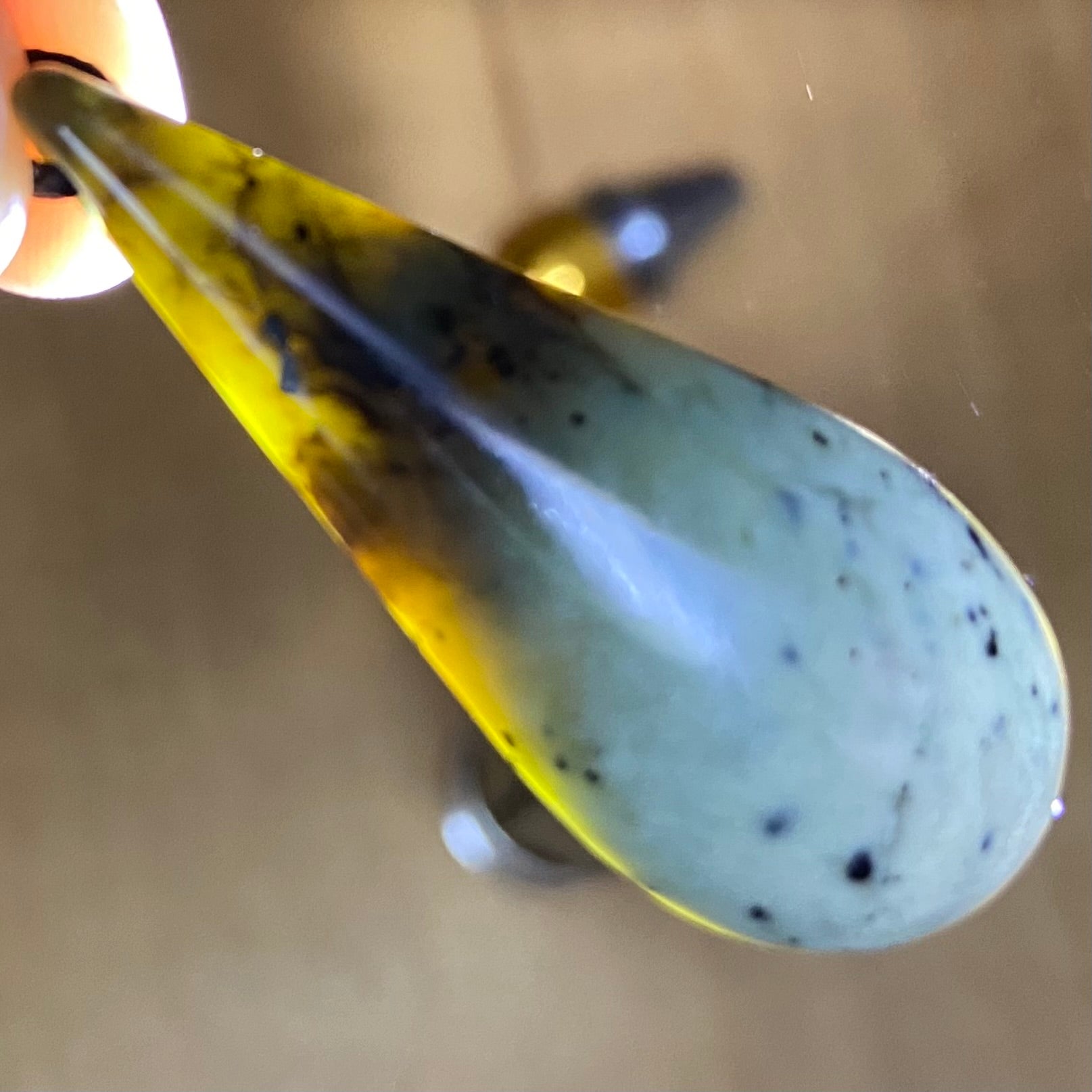 Roimata (teardrop) pendant hand-carved from New Zealand kawakawa pounamu (greenstone). Translucency.