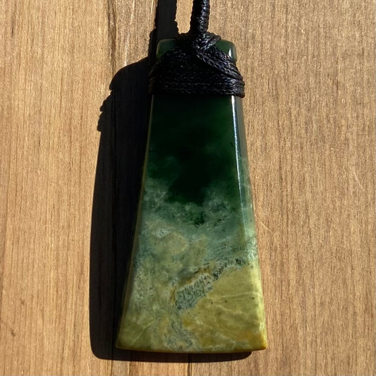 Bound toki pendant hand-carved from New Zealand Marsden Flower Jade pounamu (greenstone). Front