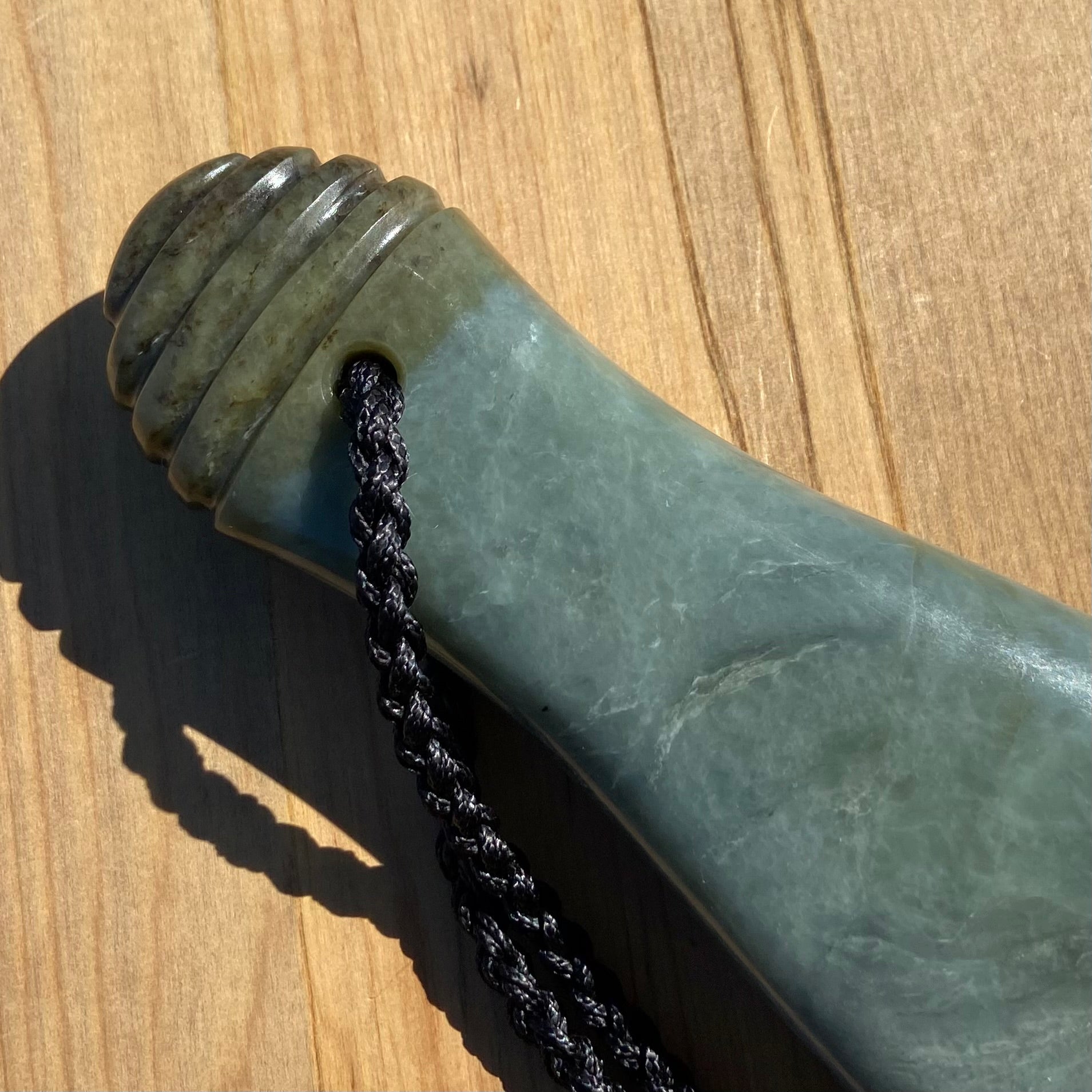 Pounamu mere hand-carved from South Westland Inanga pounamu (greenstone). Handle.